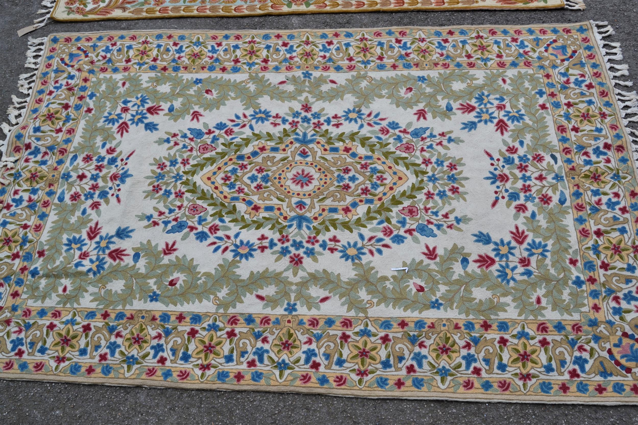 Indian Numdah rug with a medallion and all-over floral design with borders, 6ft x 3ft 10ins