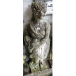 Well weathered cast concrete garden figure of a classical maiden holding a wheatsheaf, 48ins high No