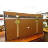 Large 20th Century brown painted canvas, metal and wooden mounted bound trunk with brass locks and