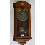 Continental Art Deco mahogany cased wall clock, the silvered dial with Arabic numerals and two train