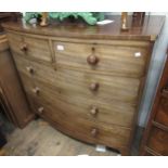 Victorian mahogany bow front chest of two short and three long drawers with knob handles and splay