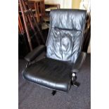 Mid to late 20th Century black leather swivel recliner chair, on black powder coated supports