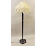 1920's Mahogany hexagonal tapering standard lamp on low bun supports, with cream damask tasselled