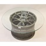 Aston Martin alloy race wheel, later mounted with a circular etched glass coffee table top, 30ins