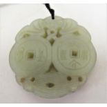 Chinese green stone carved pierced pendant on cord