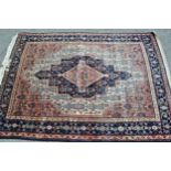 Small Hamadan rug with a medallion and all-over Herati design in shades of rose, midnight blue and