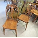 Pair of 19th Century ash and elm Windsor wheelback side chairs, with panel seats and turned supports