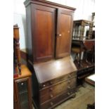 George III mahogany bureau bookcase, the moulded cornice above a pair of panelled doors and pair