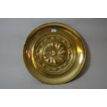 19th Century embossed brass alms dish, 19.75ins diameter