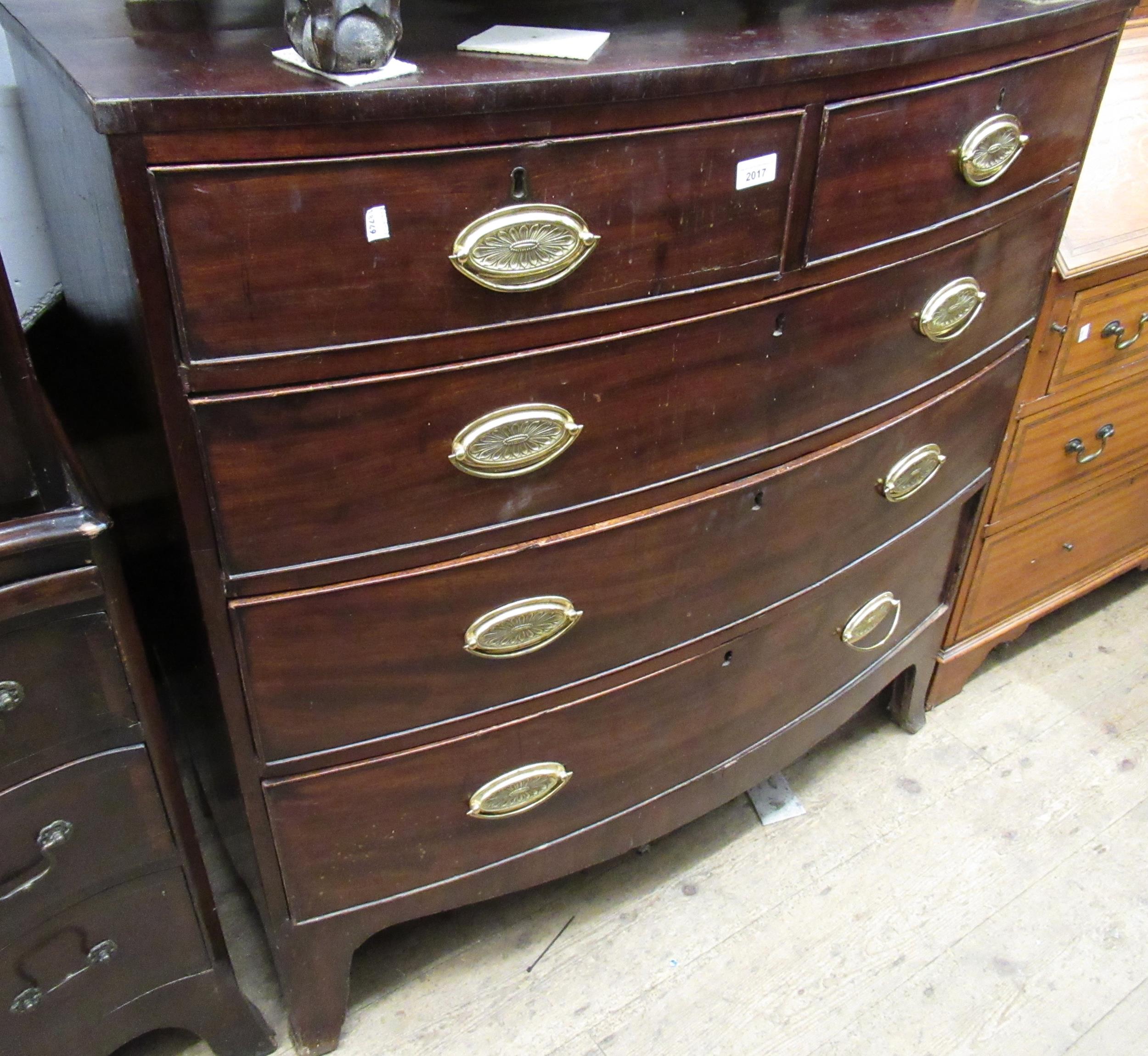 19th Century mahogany bow fronted chest of two short and three long drawers with oval brass handles,