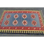 Small Kelim rug with two rows of four gols on a pale blue ground with borders, 6ft 6ins x 4ft 5ins