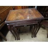 Reproduction nest of mahogany rectangular coffee tables with glass inset tops on cabriole supports