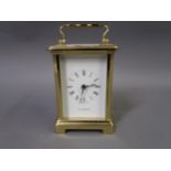 20th Century brass cased carriage clock with enamel dial inscribed H. Samuel, together with a