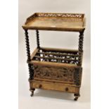 Victorian figured walnut Canterbury whatnot, the galleried top above barley twist supports, the