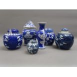 Box containing a quantity of various blue and white prunus blossom ginger jars, vases etc.