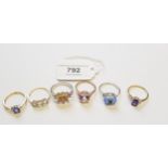 Group of five 9ct gold and gem set dress rings, together with a similar silver ring