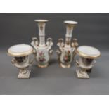 Pair of Paris Porcelain Campana style urns with handpainted floral decoration and partial gilding,