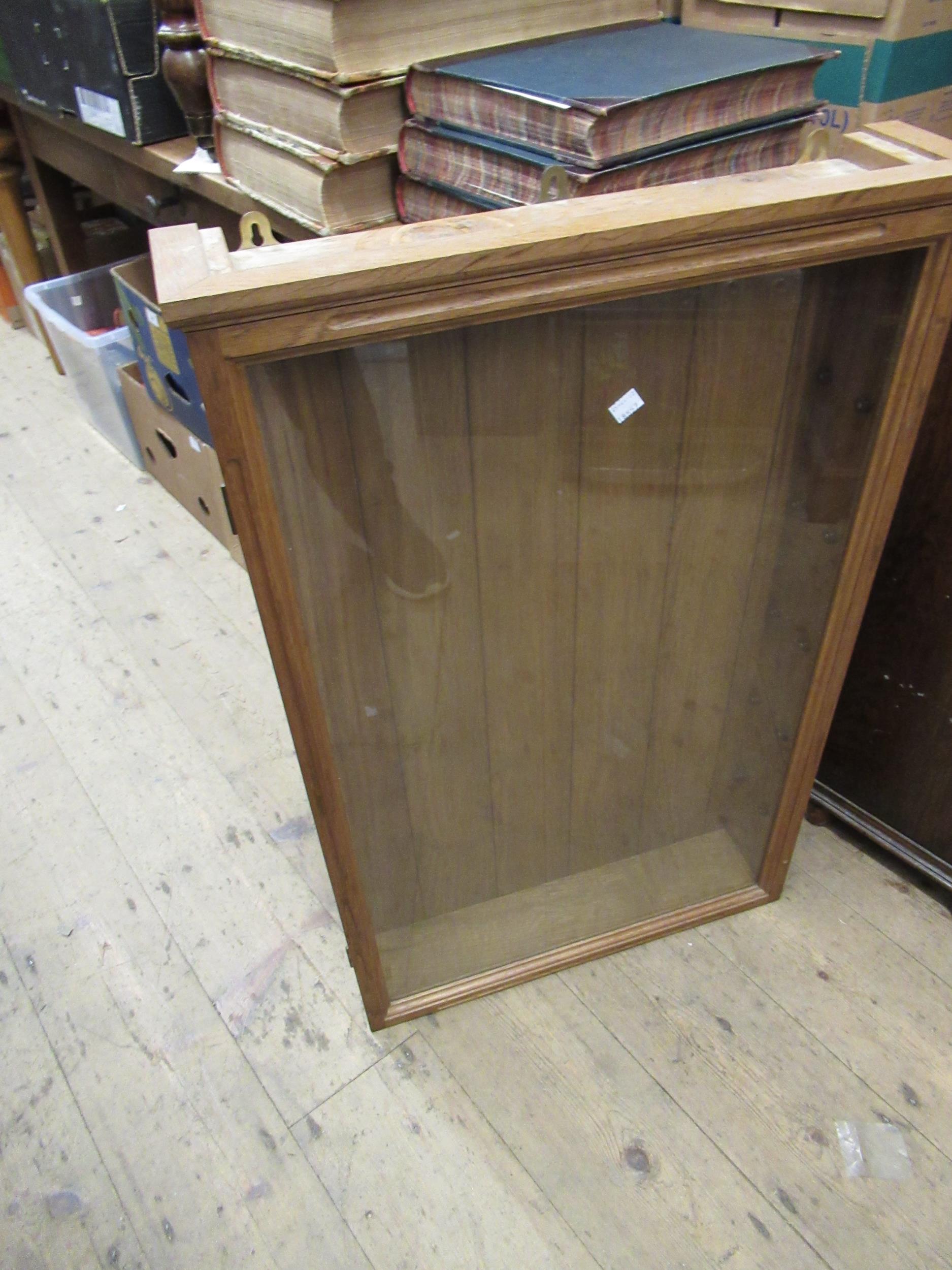 Oak and glazed hanging display cabinet, 33.5ins x 21ins