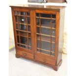 Edwardian mahogany bookcase, having two bar glazed doors with adjustable shelves and two drawers, on