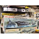 Box containing a quantity of unbuilt aviation and Naval models by Revell, Airfix, Hobby Boss, Condor