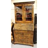 Walnut bureau bookcase, the moulded cornice above two shaped glazed panel doors enclosing shelves,