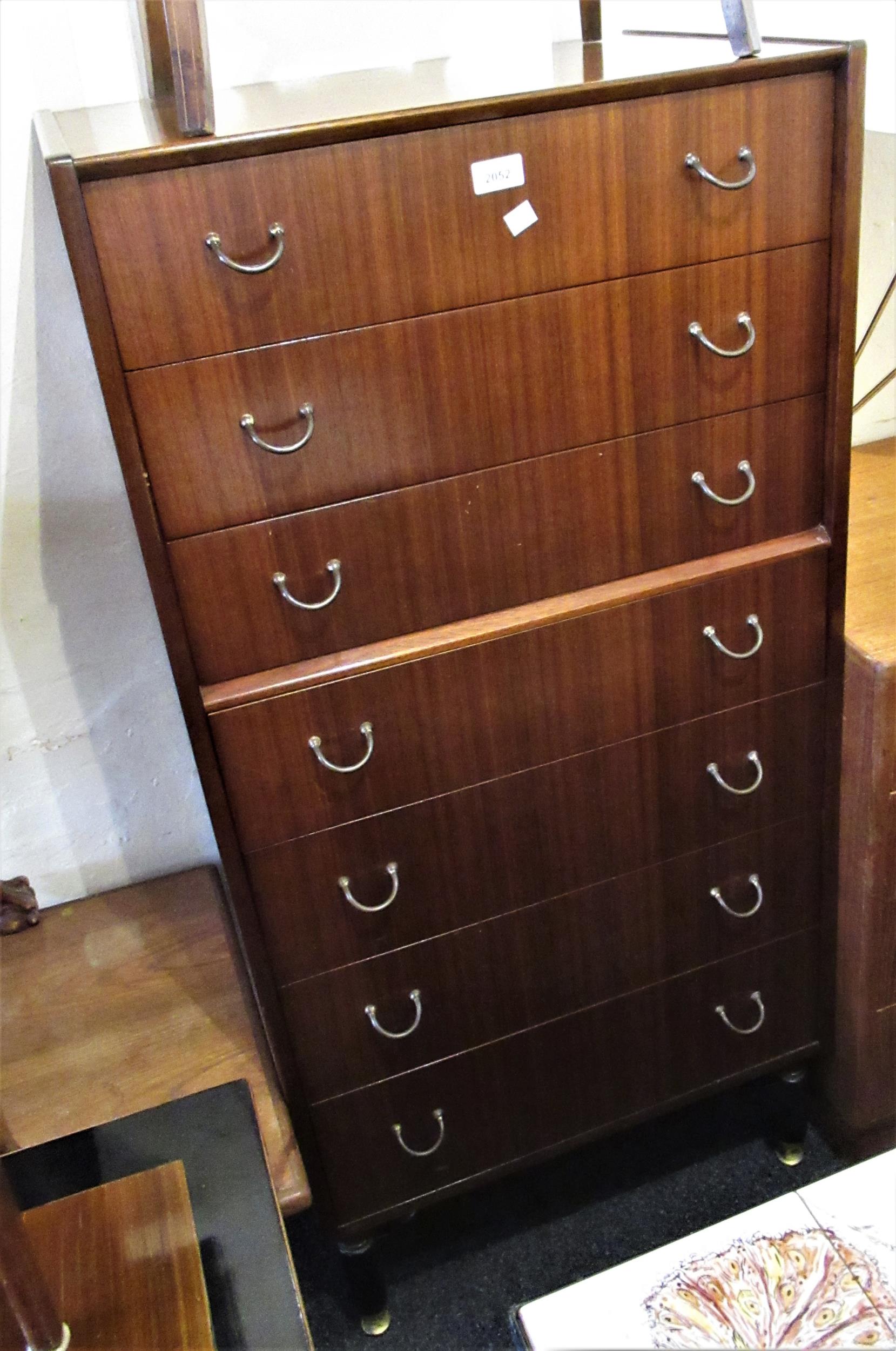 E. Gomme for G Plan, mid 20th Century teak narrow chest of seven drawers with brass handles,