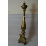Large brass baluster candlestick on triform base, 39ins high