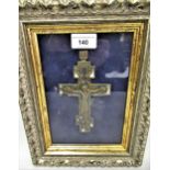 Patinated and painted brass Orthodox crucifix, 6.25ins high, in a gilt and silvered frame