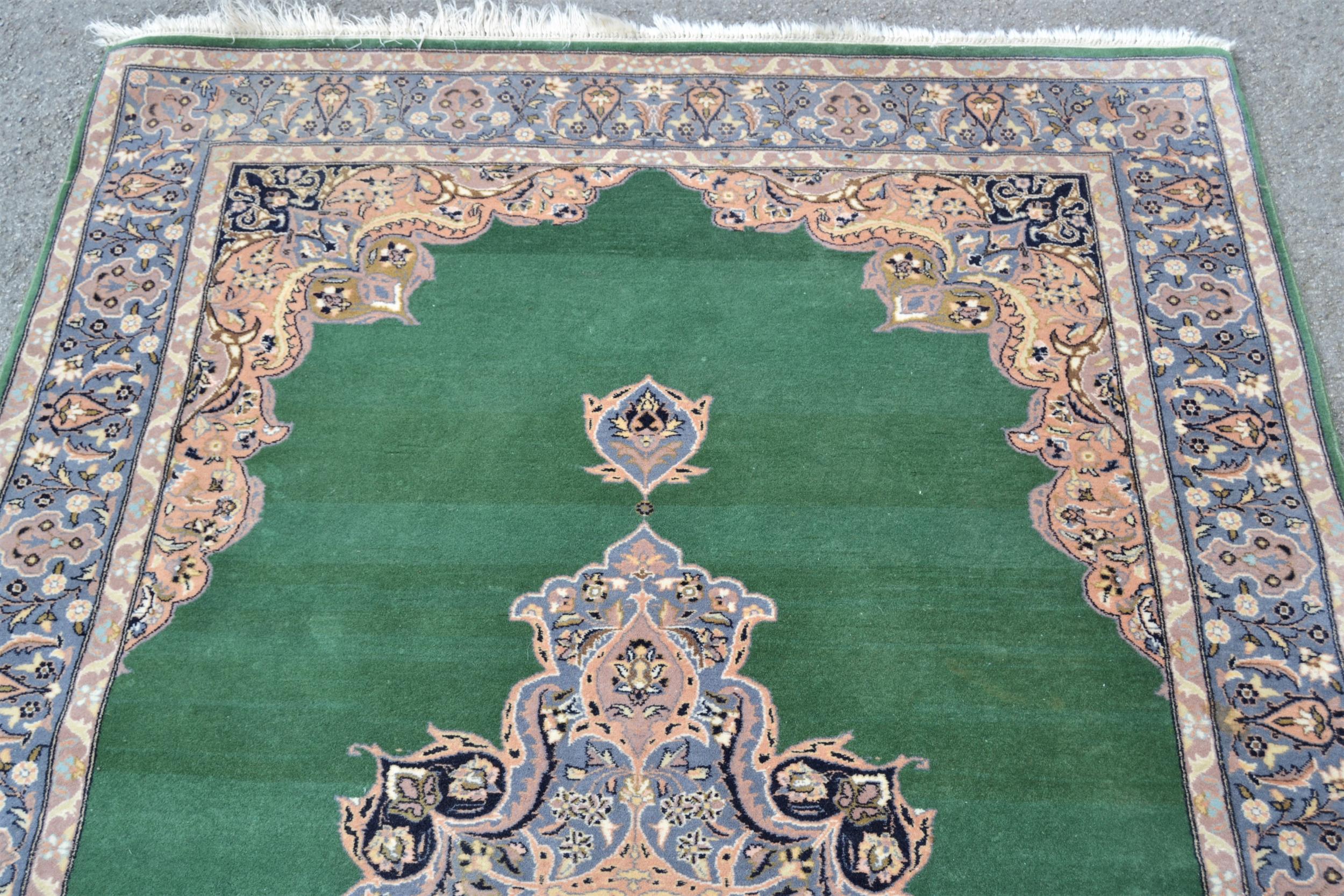 Indo Persian rug with central medallion and multiple borders on green ground, 88ins x 54ins Some - Image 3 of 4