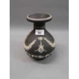 Wedgwood Etruria jasperware black and white baluster form vase with floral swag decoration (foot