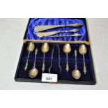 Set of six silver coffee spoons with matching sugar tongs and three silver handled shoe horns /