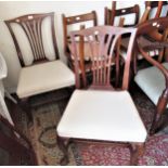 Pair of 19th Century mahogany side chairs, having slatted backs overstuffed seats and shaped