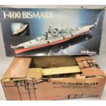 Boxed model of the Kitty Hawk Flyer and an unbuilt Heller Humbrol model kit of the Bismarck