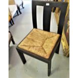 Arts & Crafts oak side chair with a plain splat back above a drop in rush seat, on plain rectangular