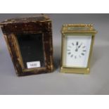 Gilt brass cased carriage clock, the enamel dial with Roman numerals, the two train movement