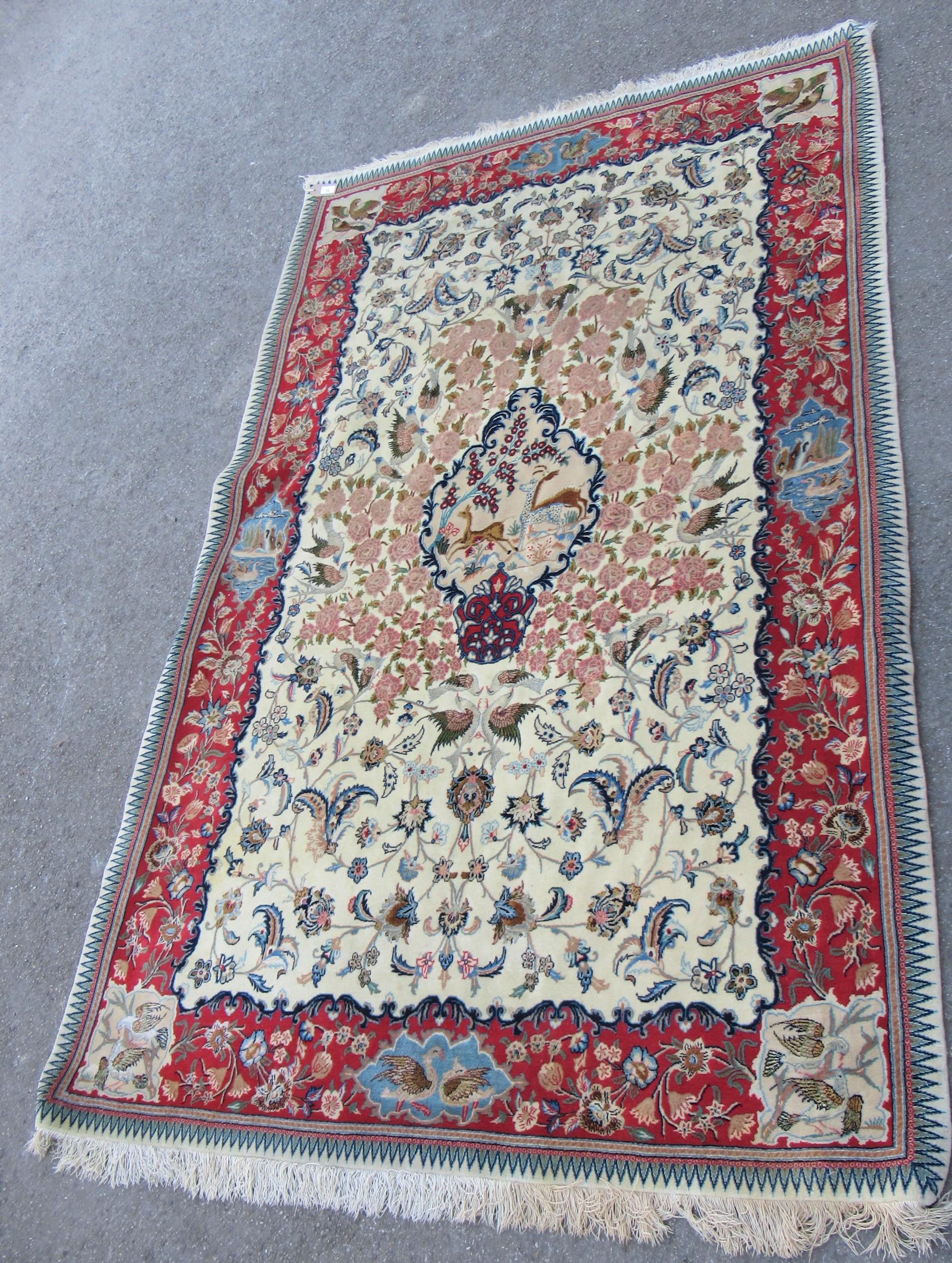 Isfahan part silk rug with a medallion, pictorial and all-over floral design on an ivory ground with - Image 4 of 13