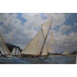 J. Stephen Dews, signed coloured print, J-Class yachts racing off a coastline, 19.75ins x 30ins