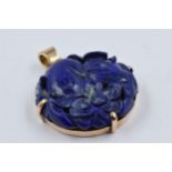 Circular 14ct gold mounted carved lapis lazuli pendant