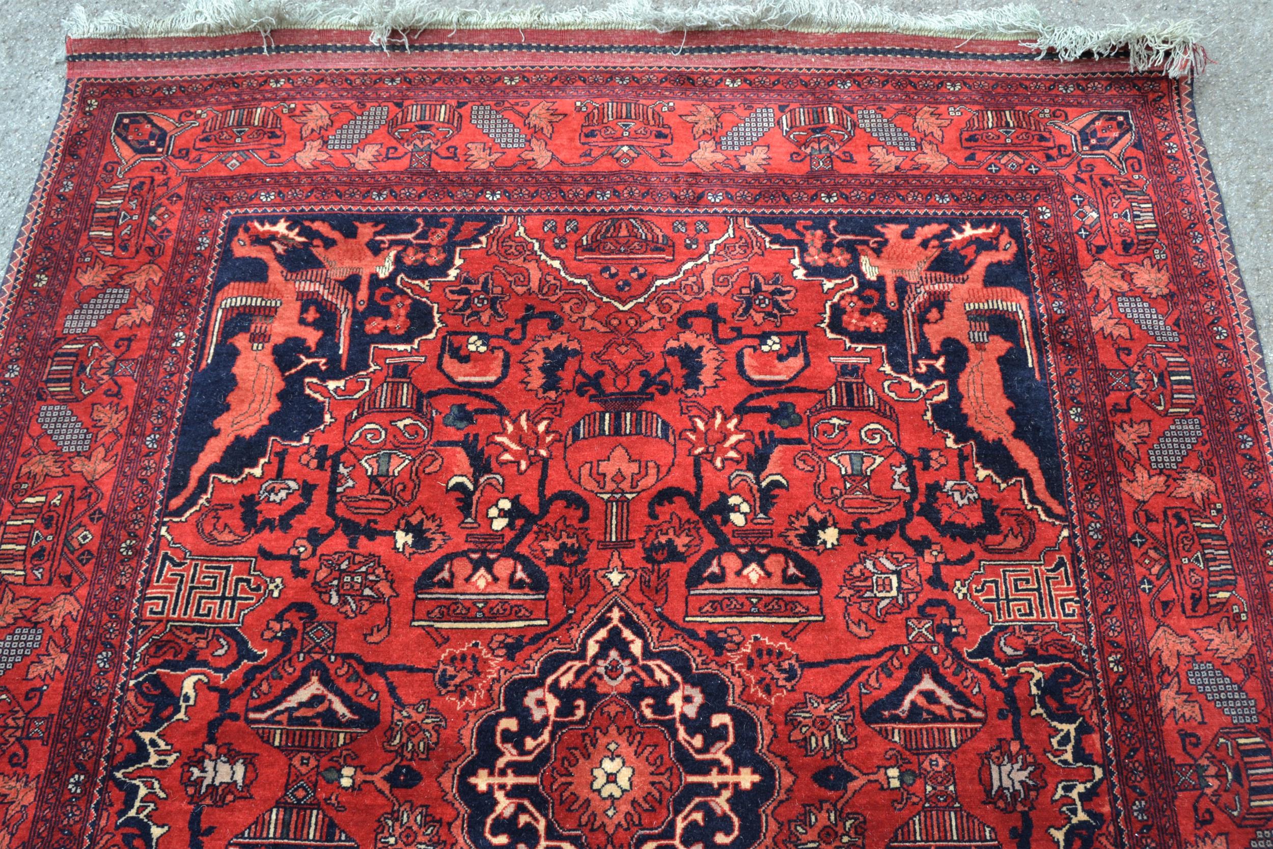 Afghan rug with a medallion and all-over stylised design, corner designs and borders, 6ft 4ins x 5ft - Image 3 of 4