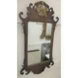 19th Century mahogany and parcel gilt wall mirror with fretwork mounts Top and bottom right hand