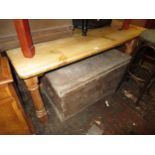 Reclaimed pine rectangular kitchen table raised on turned supports