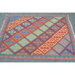 Small Kelim rug with an all-over polychrome diagonal design, 5ft 8ins x 4ft approximately