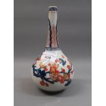 Chinese porcelain bottle vase painted in red, blue and gilt with flowers, 8ins high Various hairline