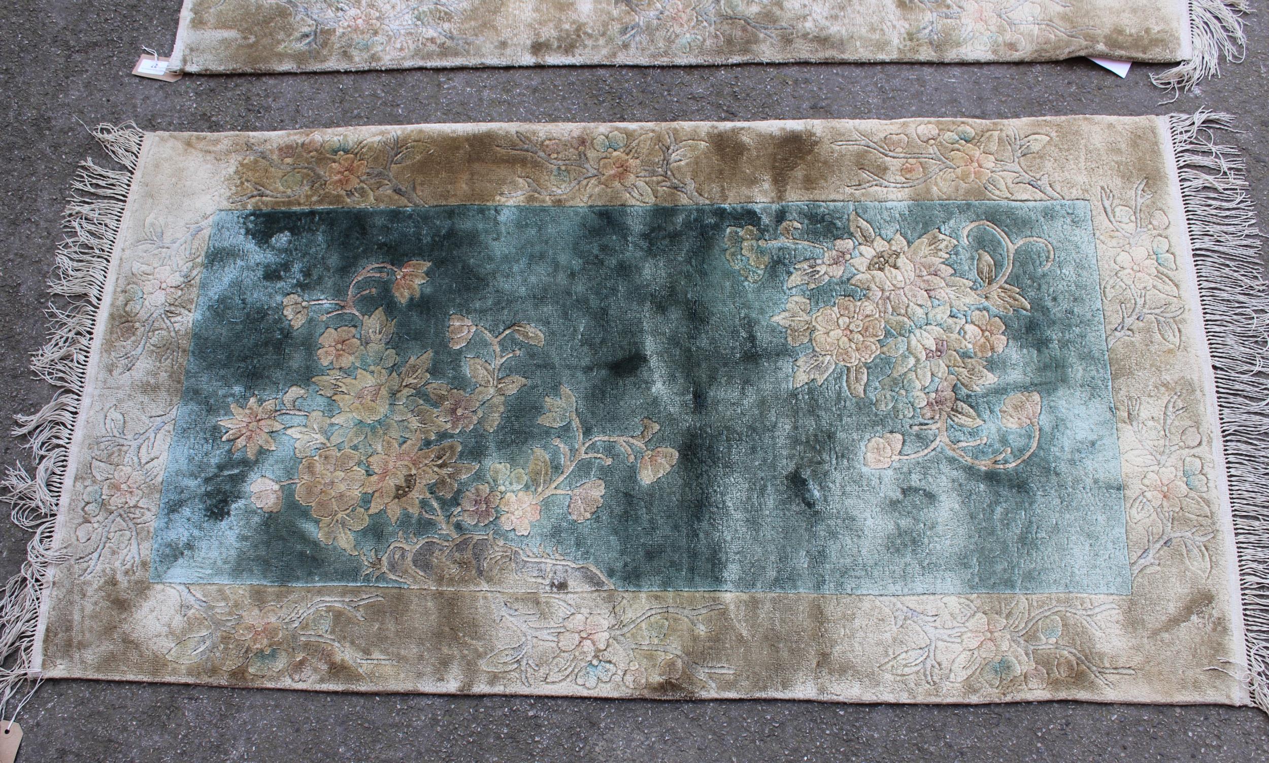 Pair of 20th Century Chinese silk rugs with floral designs on a pale blue ground with borders, 4ft - Image 2 of 2