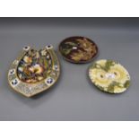 Group of three Zsolnay plates, including a floral decorated horseshoe shaped dish and two floral