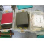 Three boxes containing a collection of various albums of world stamps and loose stamps
