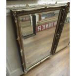 Late 20th Century rectangular gilt framed wall mirror with swept frame and bevelled plate, 26ins x