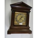 Edwardian walnut cased two train mantel clock of architectural form, the gilt dial with a silvered