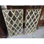 Pair of 19th Century cast iron diamond lattice window panes, 17.75ins x 35.5ins