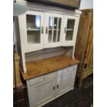 Late 19th / early 20th Century Continental pine side cabinet, the canopy top with glazed doors above